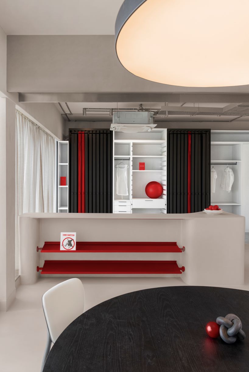 concrete and steel textures shape showroom in india organized as a continuous loop