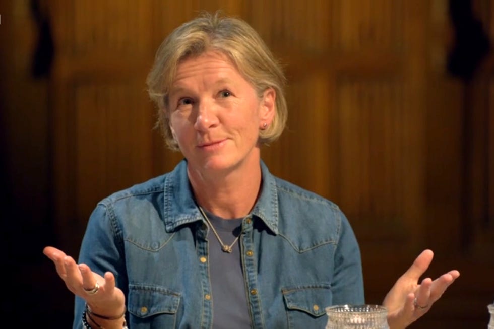 traitors season 4 amanda person gesturing while seated at a table