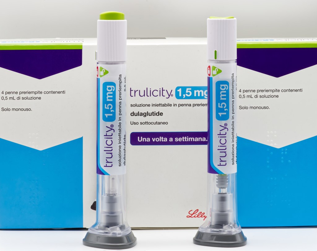 Two Trulicity 1.5mg injectable pens for type 2 diabetes, with "Lilly" logo and product information visible on the packaging.