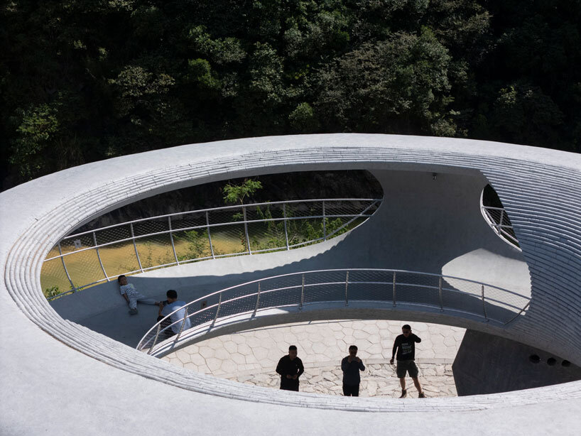 tubular concrete ring by HCCH studio shapes cycling rest pavilion among chinese hills