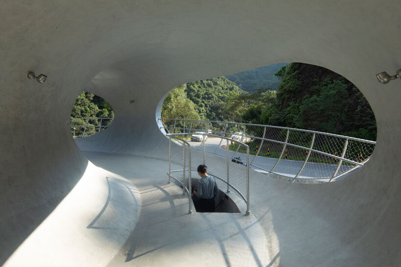 tubular concrete ring by HCCH studio shapes cycling rest pavilion among chinese hills