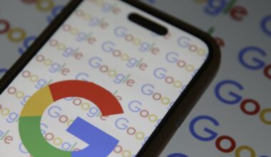 Google logo on a cell phone's wallpaper.