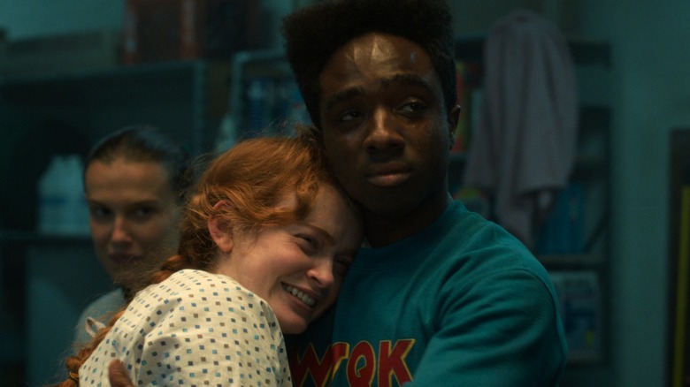 Lucas hugs Max after she returns to reality in Stranger Things