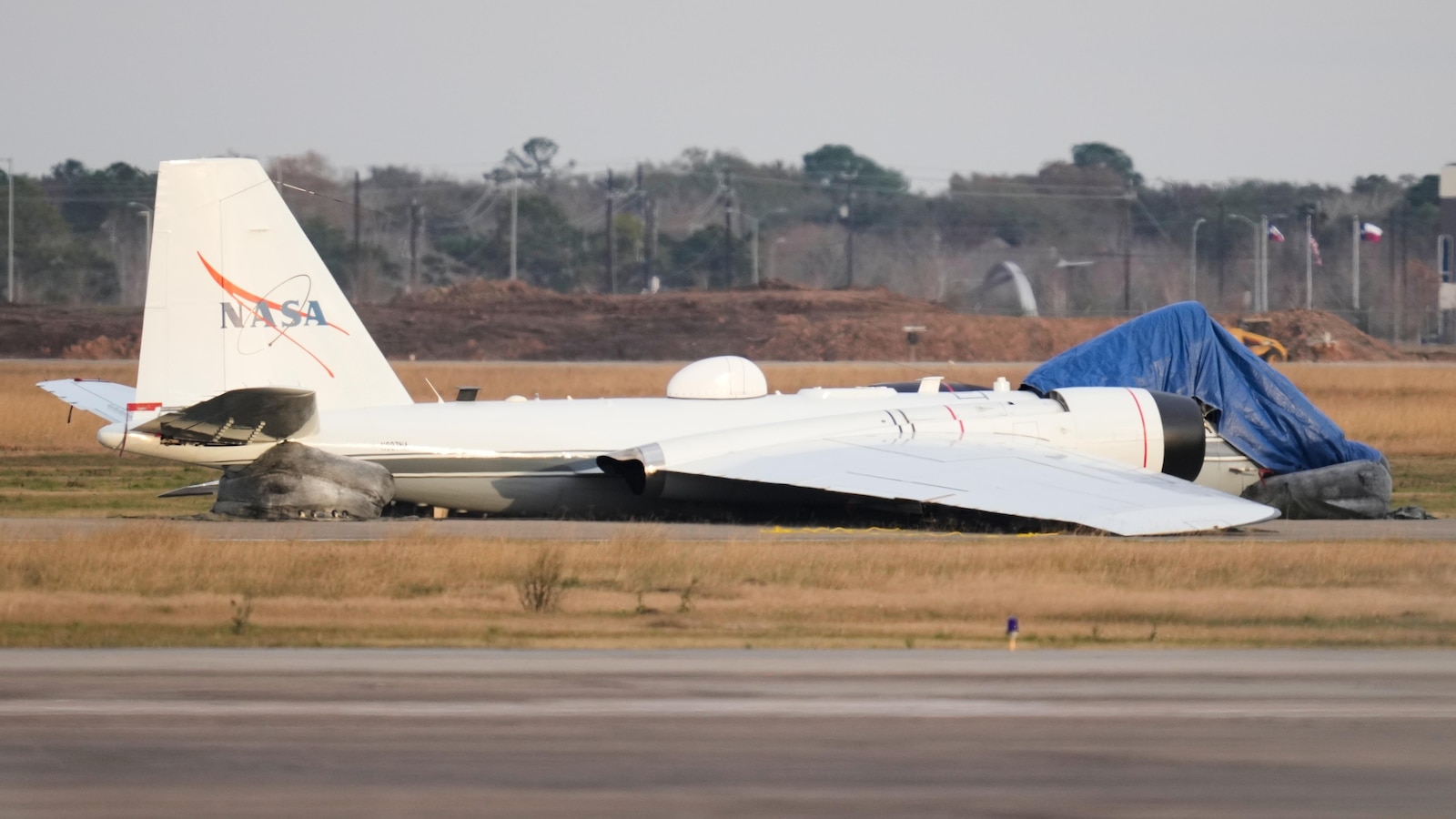 Video shows flames flying from NASA plane that touched down without landing gear