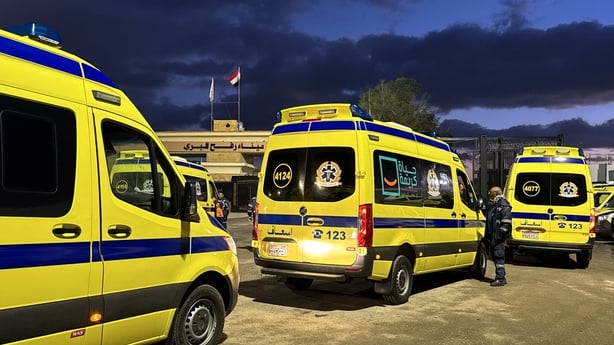 Ambulances wait on the Egyptian side of the Rafah border crossing 