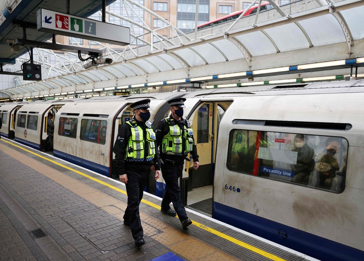 British Transport Police officer patrol the platform