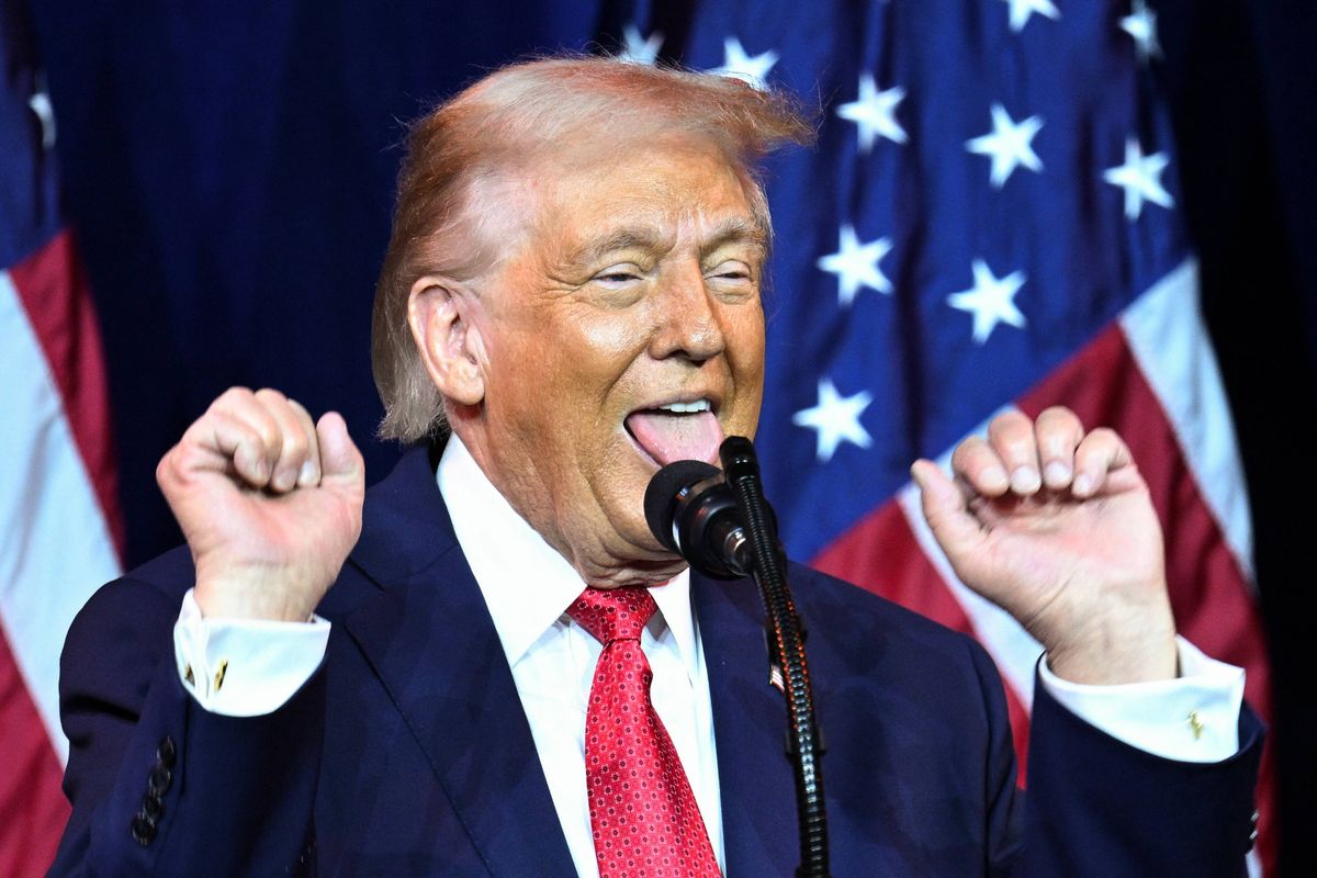 US President Donald Trump reacts as he speaks during the House Republican Party (GOP) member retreat at the Kennedy Center in Washington, DC