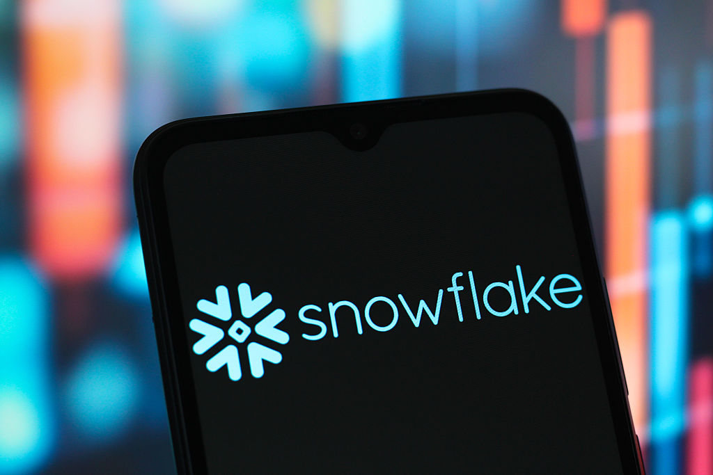 In this photo illustration, the Snowflake logo is seen displayed on a smartphone screen.