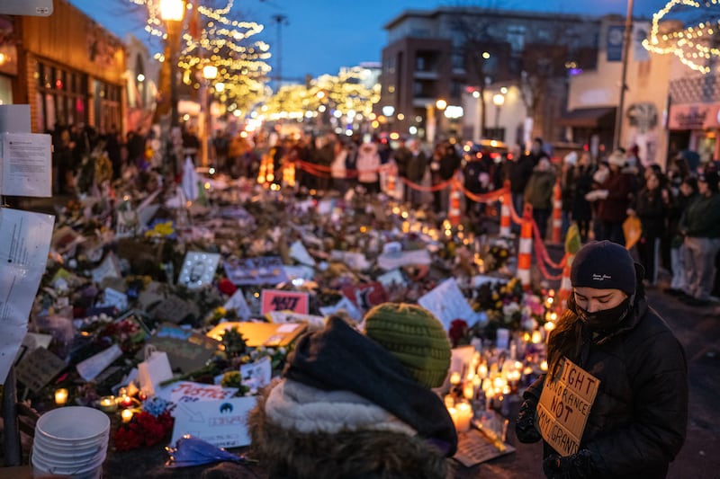 Mourners gather at the site of the killing of Alex Pretti by federal agents in Minneapolis. Photograph: Victor J Blue/New York Times
                      
