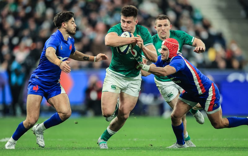 Ireland's Dan Sheehan is tackled by France's  Romain Ntamack and Gabin Villiere during a 2022 Six Nations game at the Stade de France. Photograph: Billy Stickland/Inpho