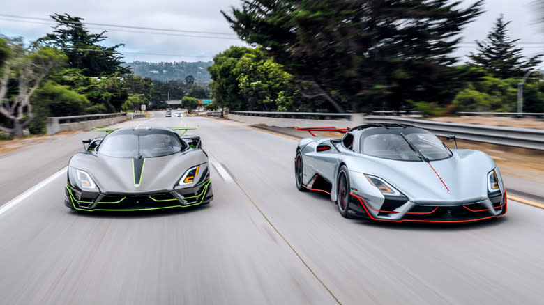 Two SSC Tuatara hypercars being driven on a public road.