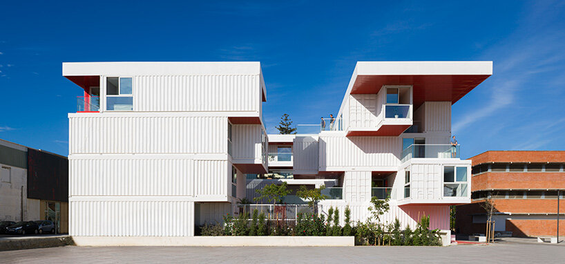 reused shipping containers form high-tech incubator by carquero arquitectura in spain