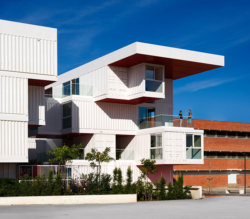 reused shipping containers form high-tech incubator by carquero arquitectura in spain