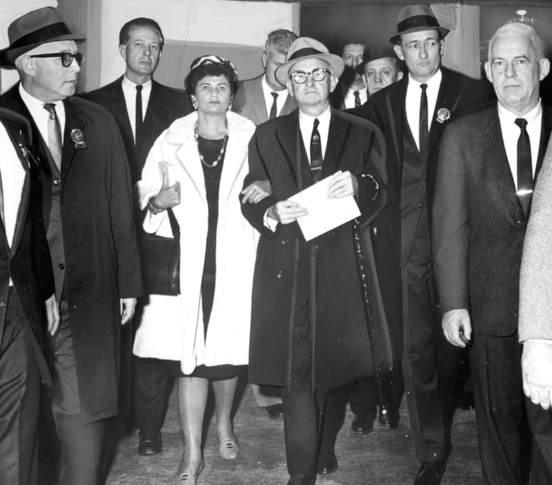 Mike and Shirley Quill surrounded by sheriffs and police officers after his arrest on January 4th, 1966 for defying a court order to end the transport strike