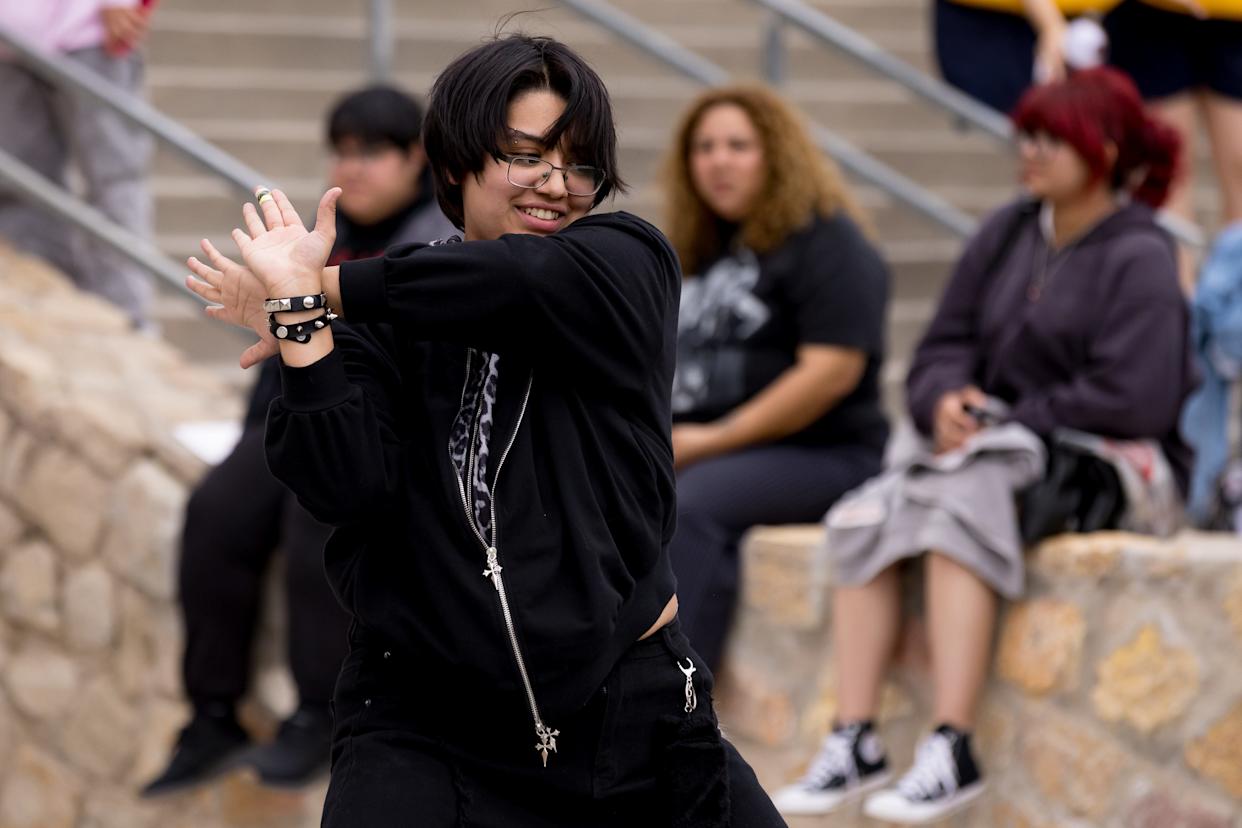 BTS fans dance to K-pop music from a speaker near the Don Haskins Center in El Paso, Texas, on Saturday, May 2, 2026, ahead of the first concert.