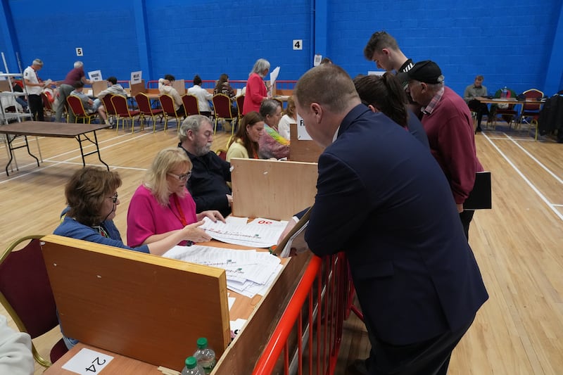 Tally men observe as counting resumes for the Galway West byelection at the Galway Lawn Tennis Club, Salthill. Photograph: Niall Carson/PA Wire