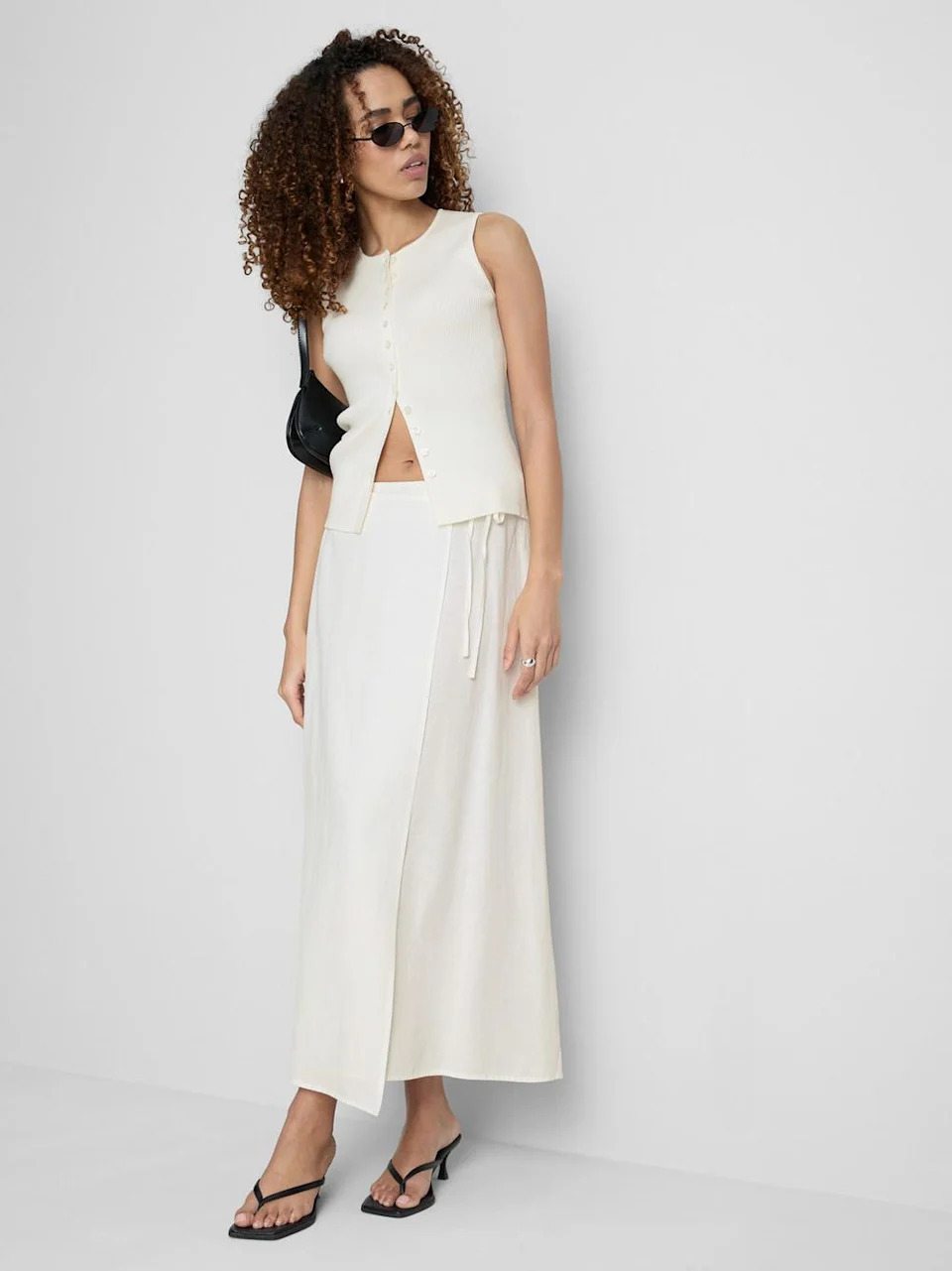 Too hot for denim? A white midi skirt is a summer staple