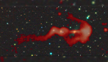 Strange glowing 'bow-and-arrow' structure may be a giant cosmic shock wave created by a supersonic galaxy c...