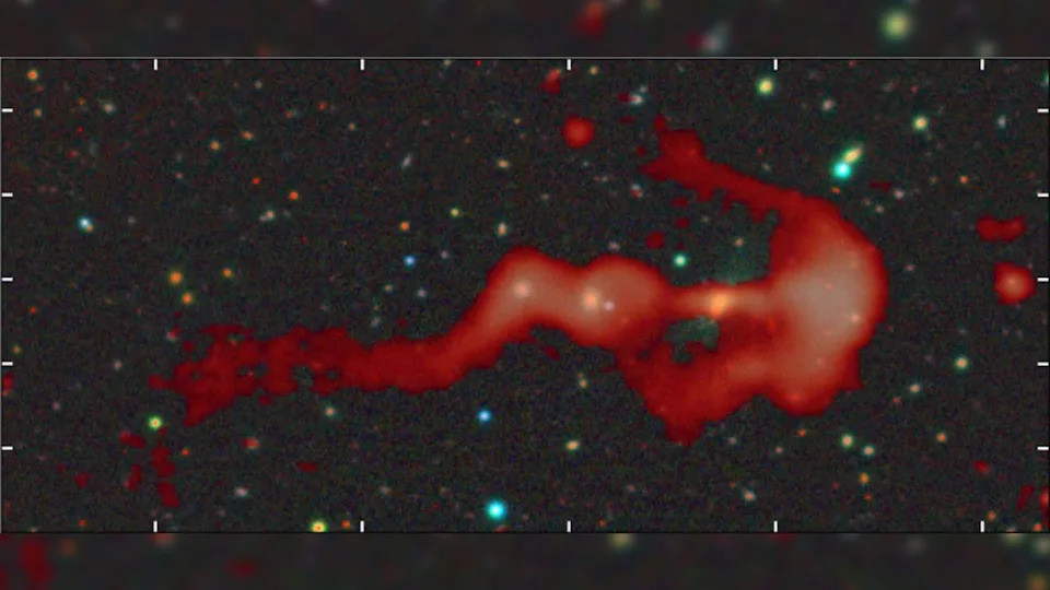 A red wisp of gas on a starry background.