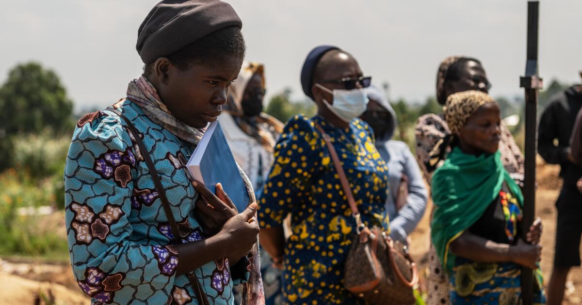 Mourners bury a 6-month-old Ebola victim in Congo