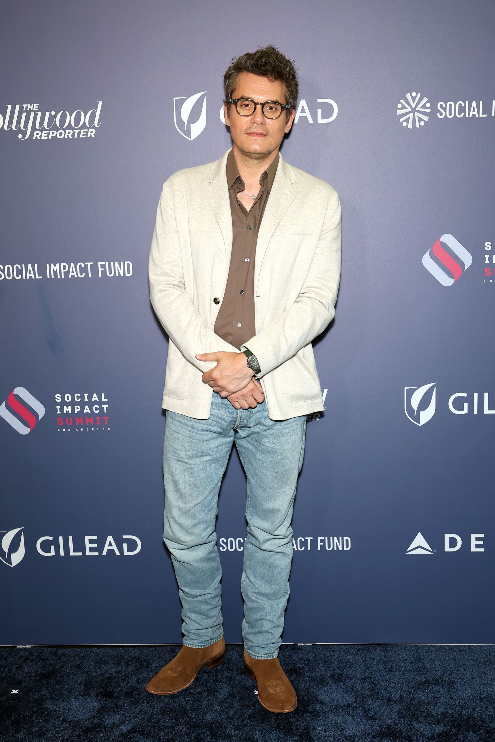 Image may contain John Mayer Blazer Clothing Coat Jacket Person Standing Pants Adult Head Face and Fashion