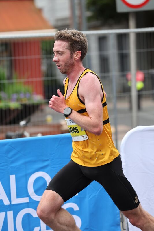  Half Marathon winner, Ryan Creech, on the Grand Parade just before the finish line.