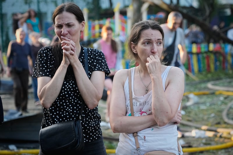 People react at the site of a Russian missile strike that hit a residential building in Kyiv, Ukraine. Photograph: Efrem Lukatsky/AP
