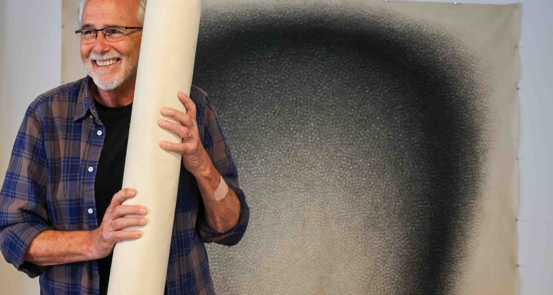 Bay Area artist Jack Scott hangs artworks for a rare exhibit