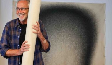 Bay Area artist Jack Scott hangs artworks for a rare exhibit