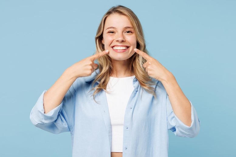 Young Happy Woman Pointing at Smile Teeth