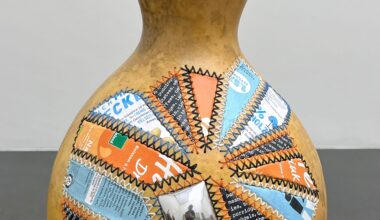 a gourd with colorful aluminum patches sewn on the side