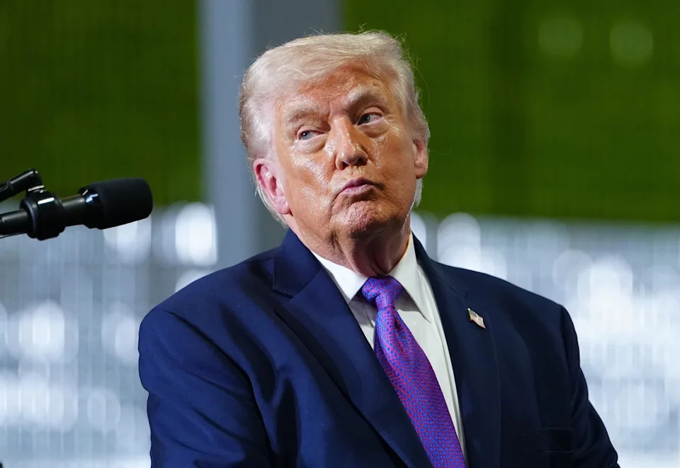 Julia Demaree Nikhinson/AP - PHOTO: President Donald Trump pauses after a person in the crowd needed medical assistance as he speaks at Verst Logistics, March 11, 2026, in Hebron, Ky.