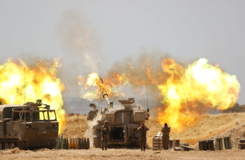 IDF Artillery Corps are seen firing into Gaza following heavy rocket and missile barrages fired into Israel from the Strip, on May 12, 2021.