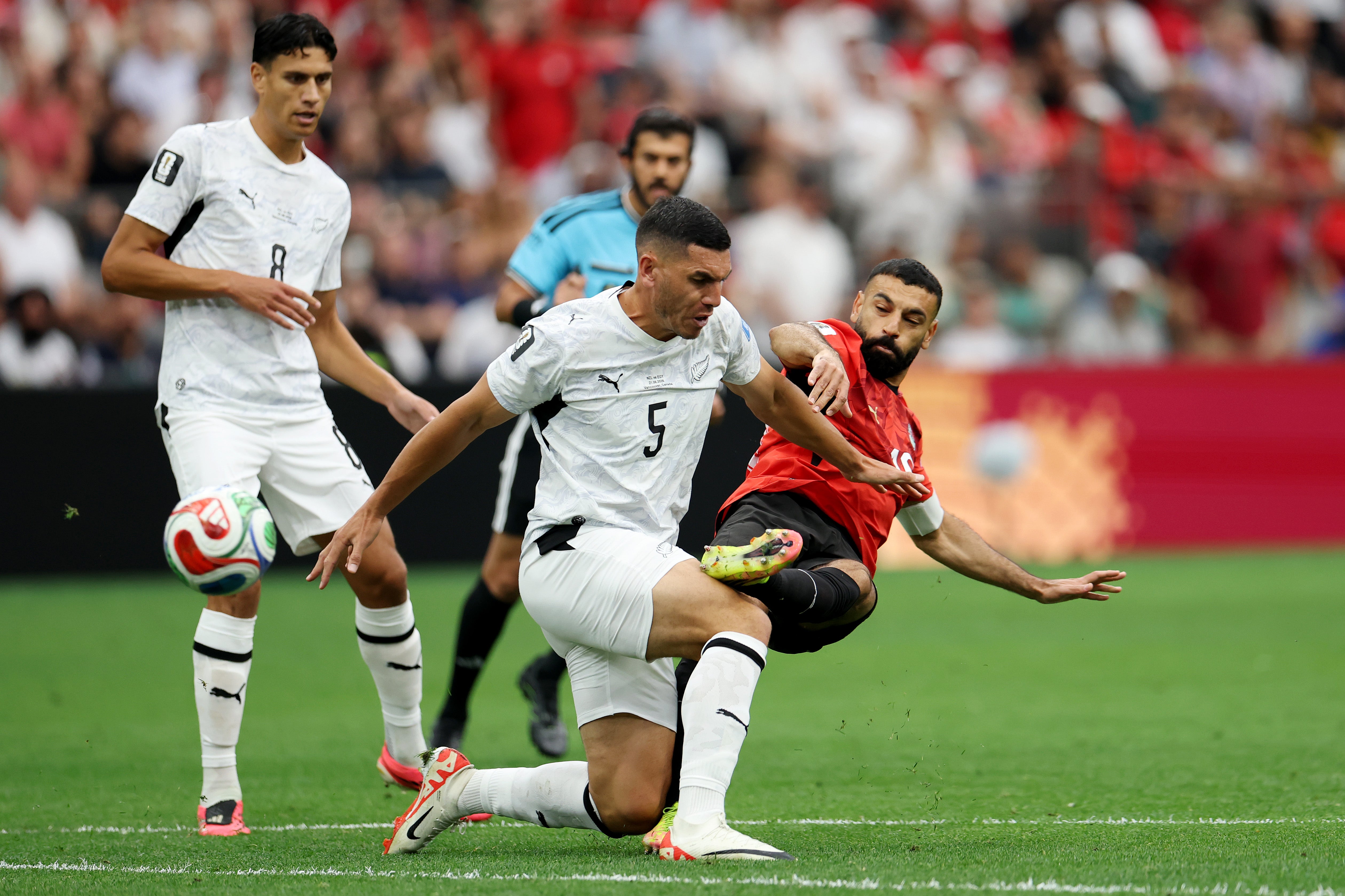 Mohamed Salah #10 of Egypt competes with Michael Boxall #5 of New Zealand during the FIFA World Cup 2026 Group G match between New Zealand and Egypt at BC Place Vancouver on June 21