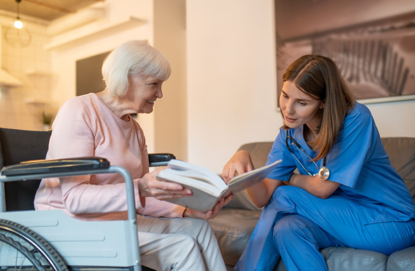 A medical professional with an elderly patient.