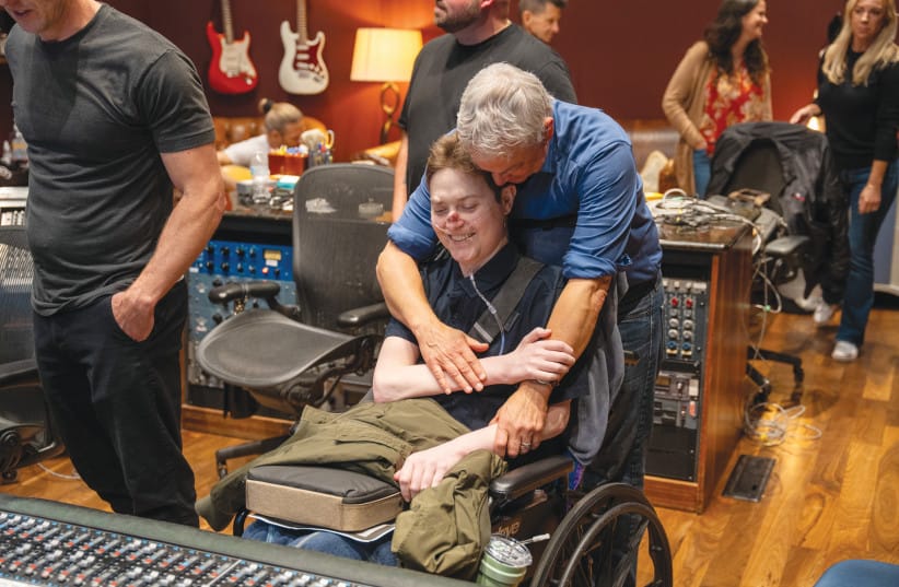With Son Mac during a recording session.