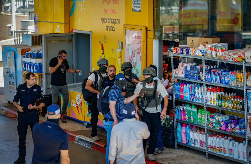 Security and rescue forces at the scene where terrorists opened fire at civilians in a terror attack at the gas station at the entrance to Kokhav Yair, June 7, 2026.