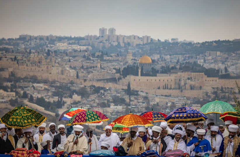 Ethiopian Jews take part in a prayer of the Sigd holiday on the Armon Hanatziv Promenade overlooking Jerusalem on November 28, 2024.