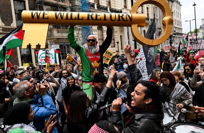 A man holds a mock-up of a key during a march, held by Palestine Solidarity Campaign, to mark the 78th anniversary of the Nakba in London on May 16, 2026.