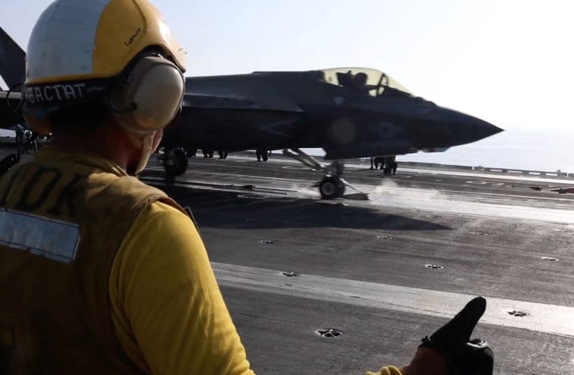 A screengrab from a video released by U.S. Central Command (CENTCOM), which accompanied a press release describing the operation dubbed ''Epic Fury'', an attack by the United States and Israel on Iran, shows a flight deck crew member signaling an F‑35 jet on an aircraft carrier