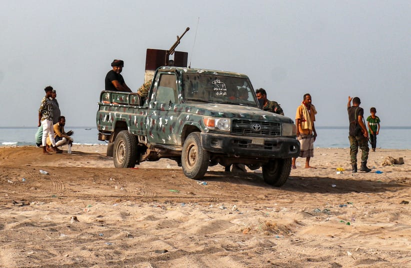 A ''technical'' (pickup truck carrying a turret in its bed) is pictured as fighters supporting the Aden-based internationally-recognised Yemeni government gather during a vigil along the Red Sea shore in Khokha, in Yemen's western Hodeidah province on July 20, 2026.