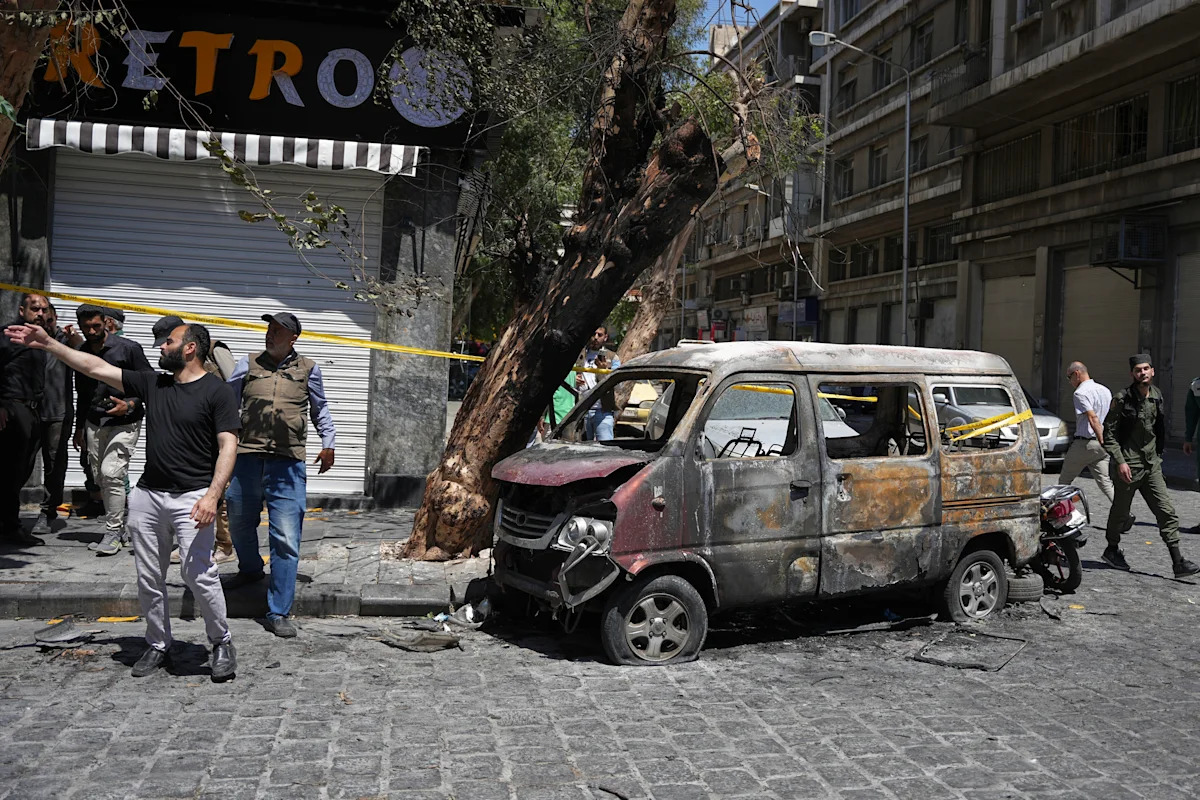 Syria says it arrested IS-linked suspects behind the Damascus bombings during Macron's visit