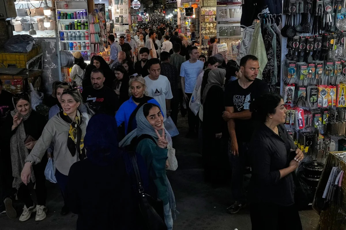 US strikes bridges and collapses a tower at a key port as its Iran campaign expands