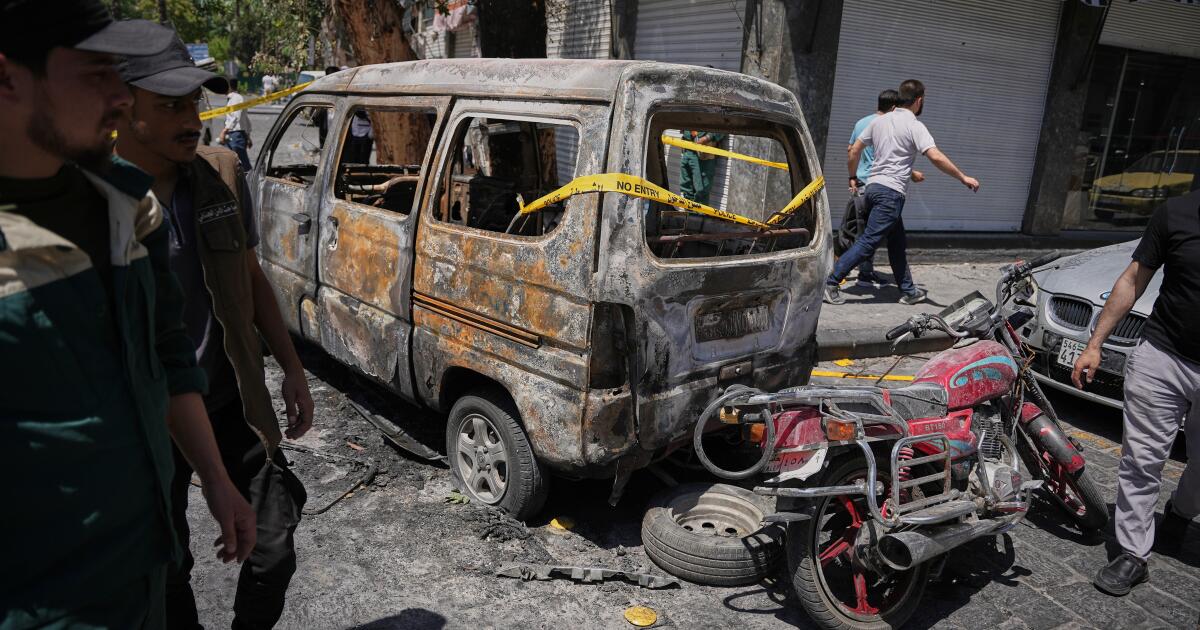 Explosions rock Syria's capital as French President Macron visits
