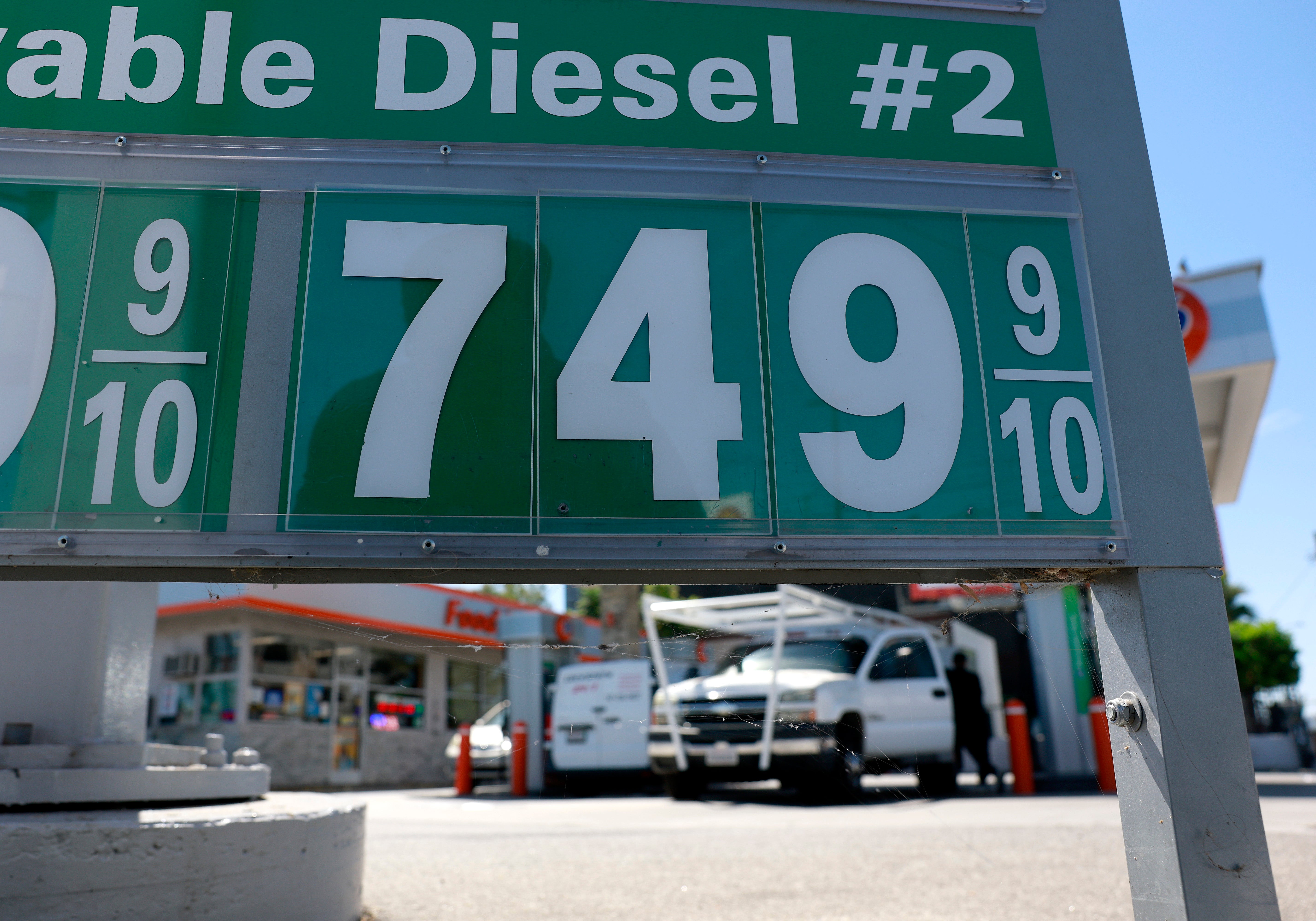 Diesel prices over $7 a gallon are displayed on a pump at a gas station