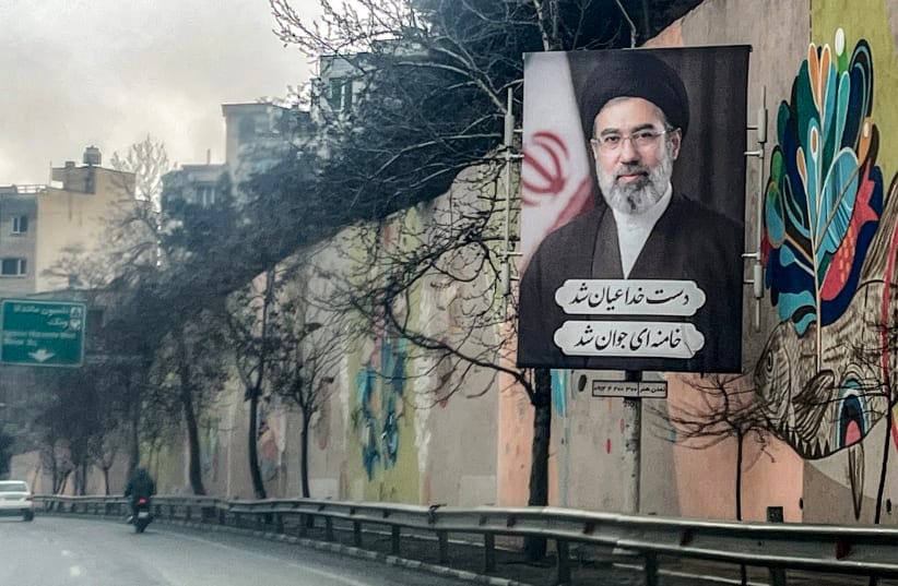  A banner depicting Iran's new Supreme Leader Ayatollah Mojtaba Khamenei is displayed on the side of a highway in Tehran on March 10, 2026.