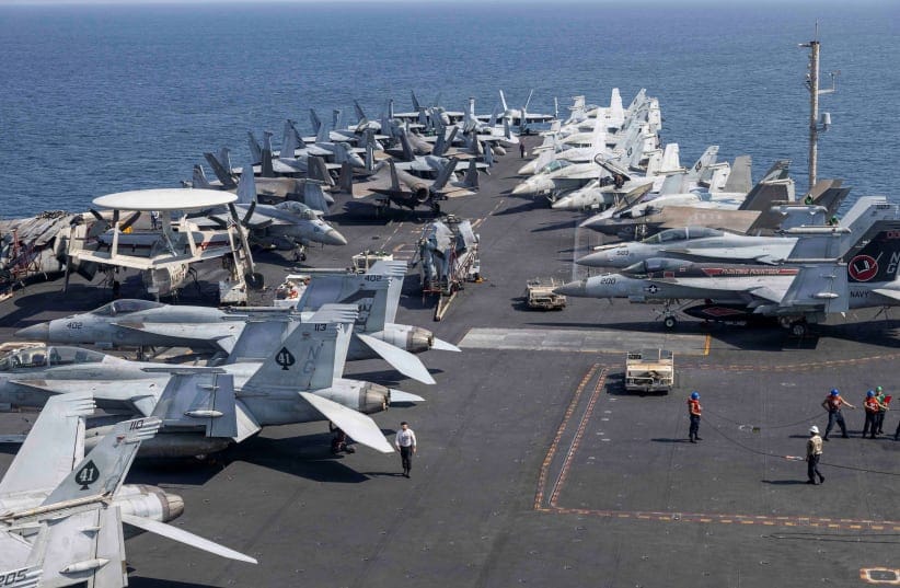 US Navy and US Marine Corps aircraft attached to Carrier Air Wing (CVW) 9 are arrayed on the flight deck of the Nimitz-class aircraft carrier USS Abraham Lincoln during the Operation Epic Fury attack on Iran from an undisclosed location March 10, 2026.