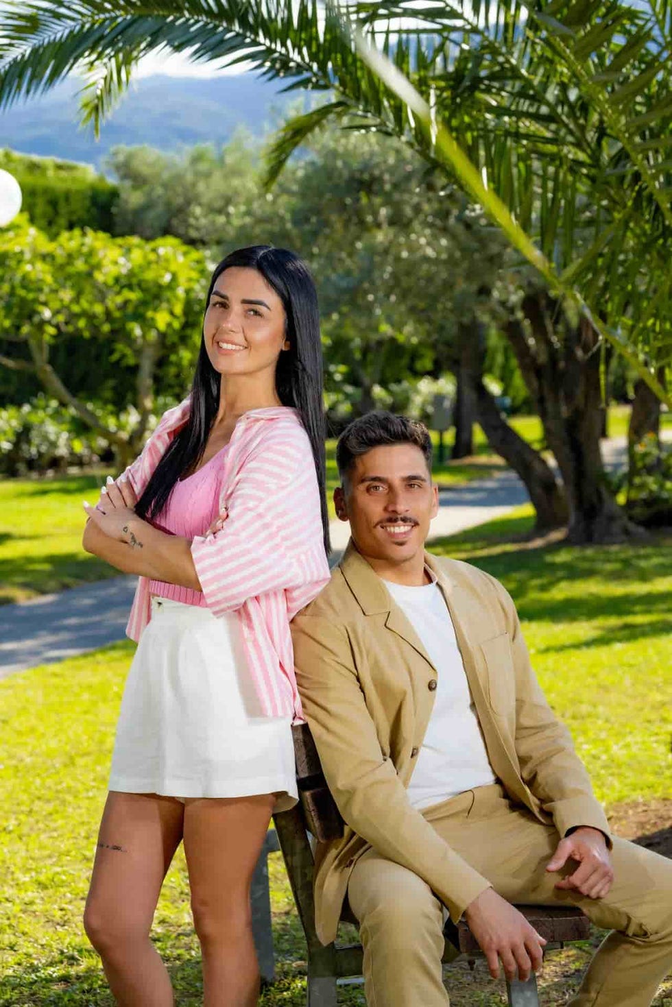 outdoor portrait of two individuals in a garden setting