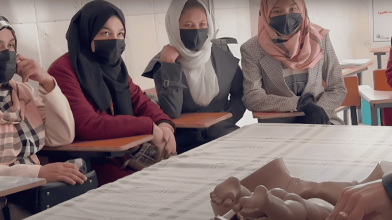 Afghan women attend a midwifery course before it was shut down by Taliban forces in 2024. Screenshot from YouTube. 