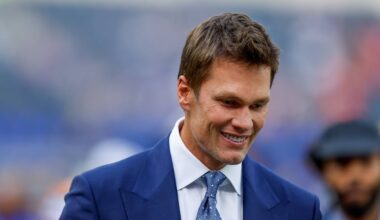Tom Brady talks to fans before an NFL game